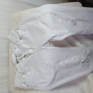 Adriana junior girls' distressed white denim jeans.